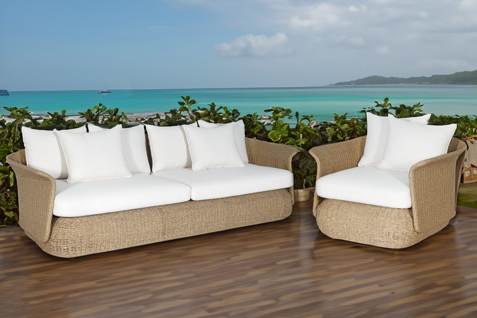 Catalina 3 Seater Outdoor Lounge in rattan cane natural colour with white cushions front view beachside on patio backyard with arm chair